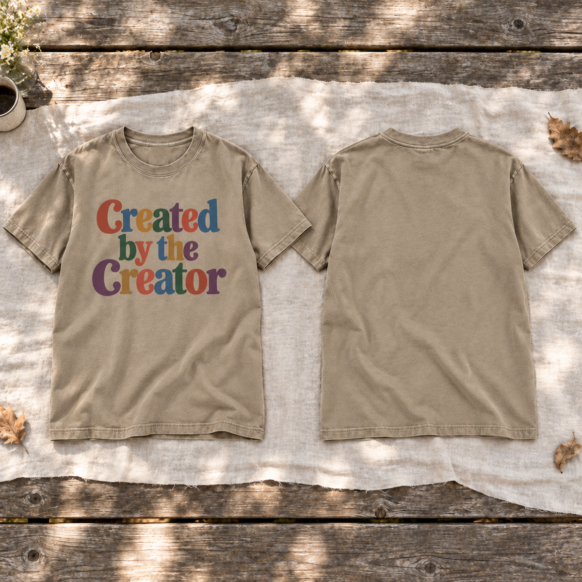 Square front-and-back flat lay of the Khaki tee: colorful front lettering and blank back.