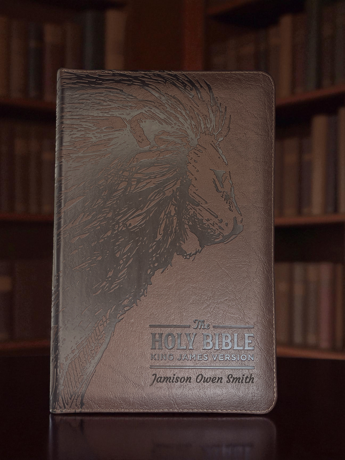 Close-up of a lion design and name engraved on a Bible