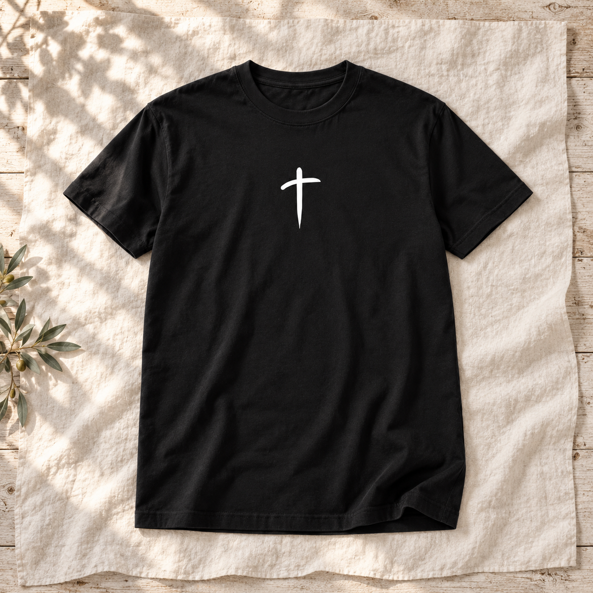 Cross Unisex Garment-Dyed Tee — square editorial flat lay, AI-styled