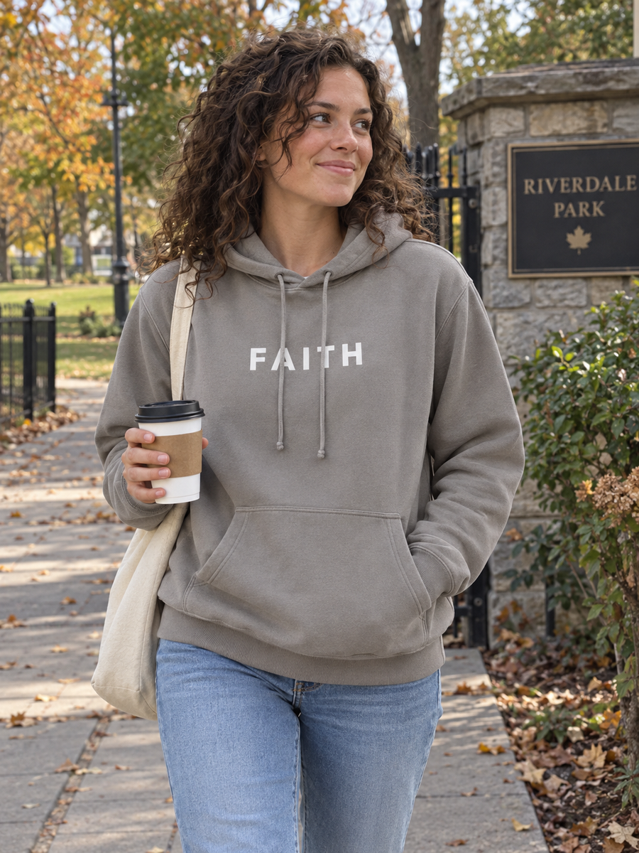 Faith Unisex Pigment-Dyed Hoodie Sweatshirt — Woman with coffee outside park