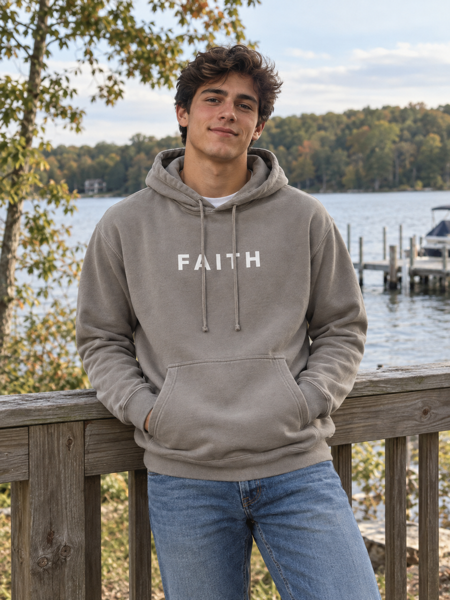 Faith Unisex Pigment-Dyed Hoodie Sweatshirt — Man at lakeside rail