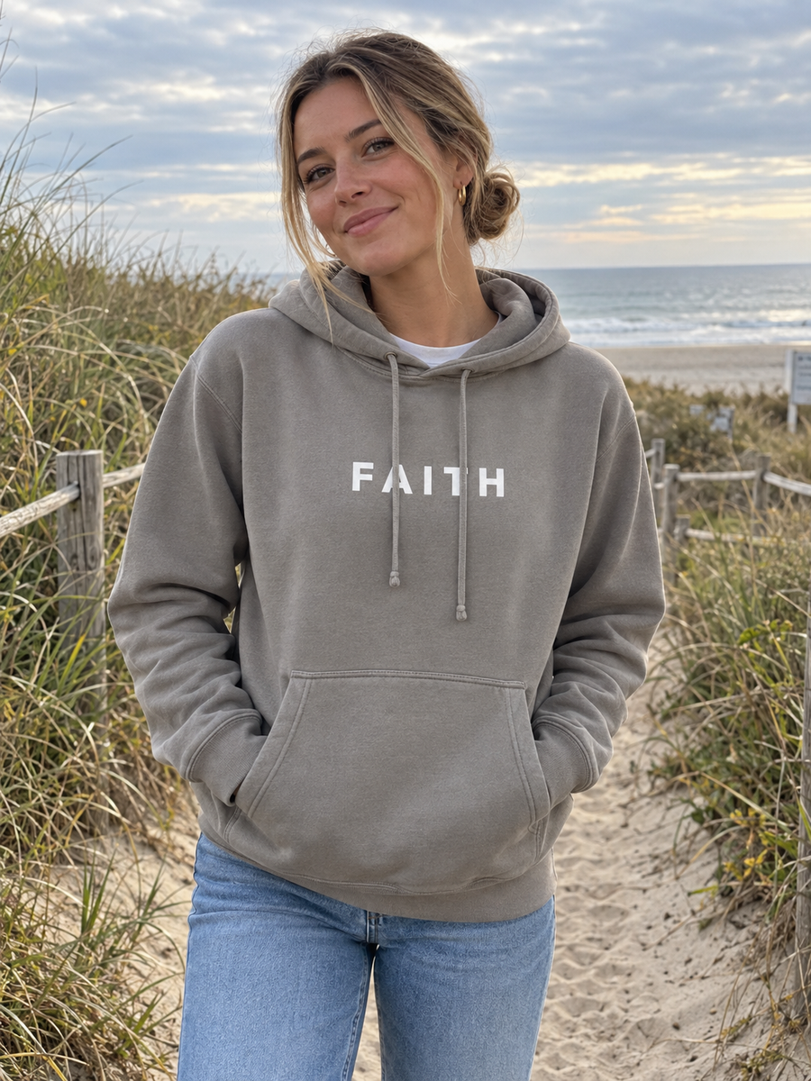 Faith Unisex Pigment-Dyed Hoodie Sweatshirt — Woman on dune grass footpath