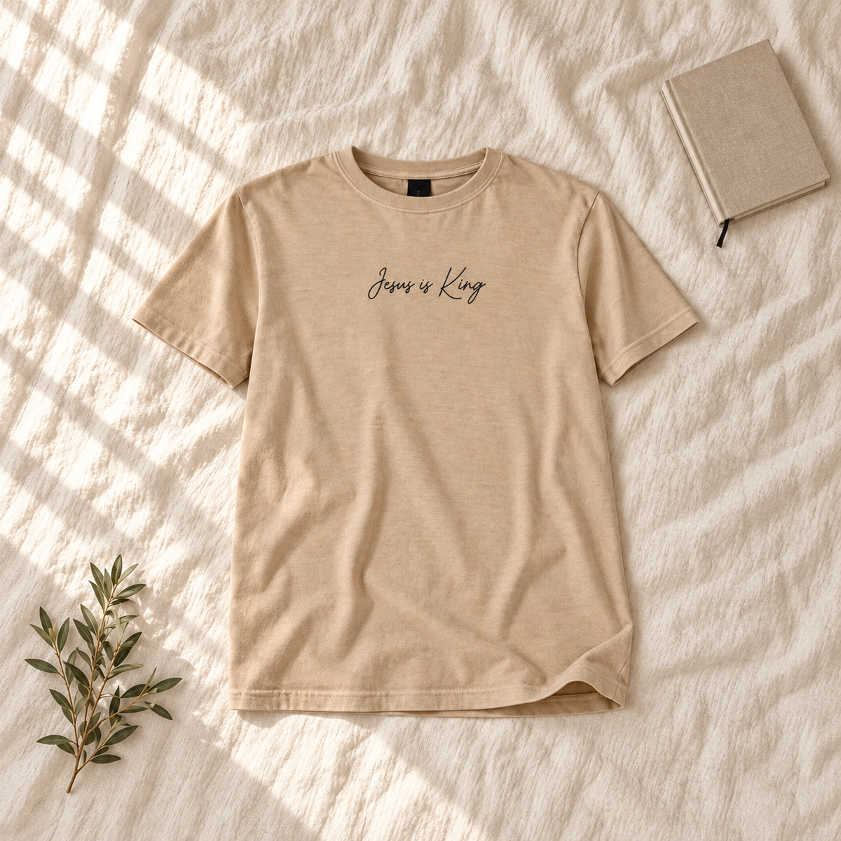 Jesus is King 1 Unisex Garment-Dyed Tee — square editorial flat lay, AI-styled