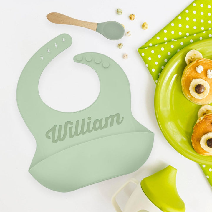 Personalized Silicone Bib and Spoon Set with Engraved Debossed Custom Name, Babies/Toddlers Durable Adjustable with Pocket for Baby Boy & Girl Color Green - Shepherds Shelf