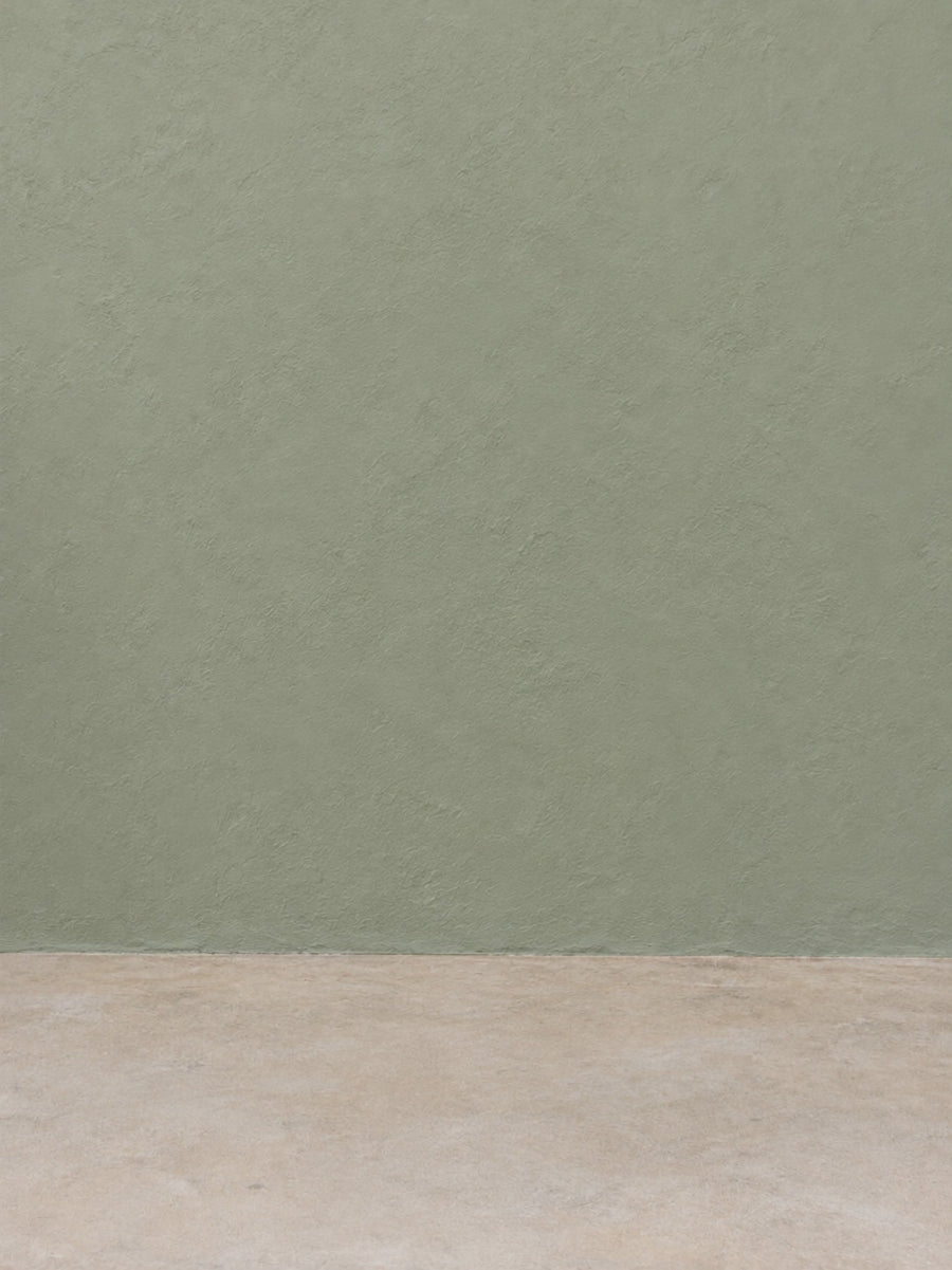 God Is Good Tee Khaki — candid single walk-in on a sage-green wall set