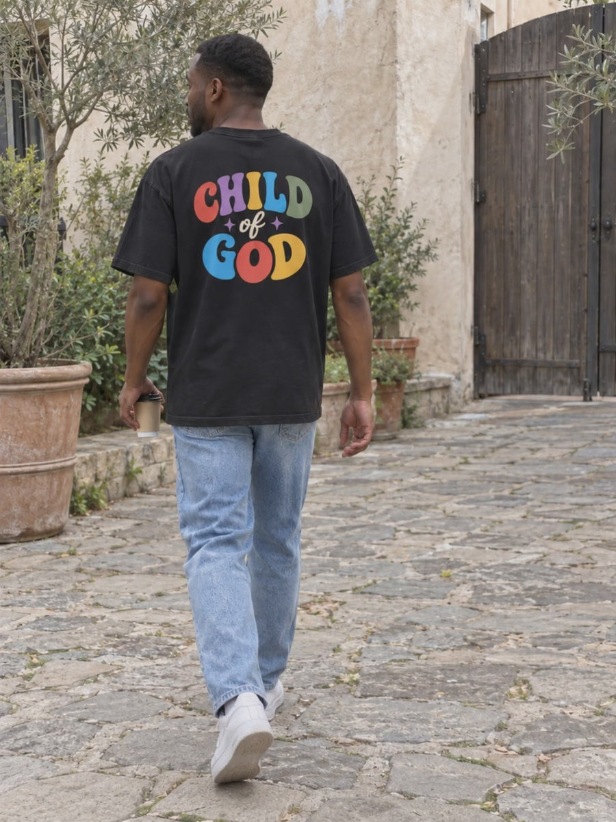Child of God tee back and front in two natural garden courtyard scenes.