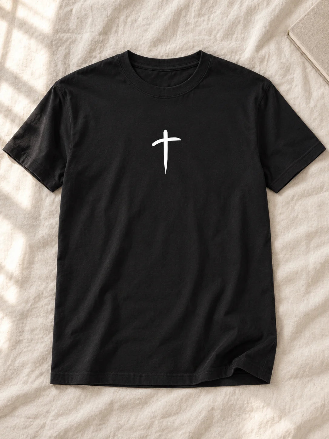 cross flatlay — AI-styled flat lay of the tee