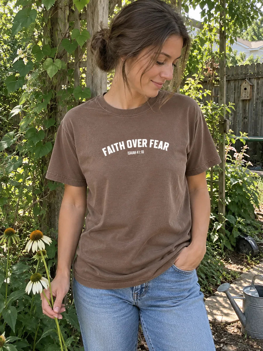 AI-created candid garden scene with a woman wearing the brown Faith Over Fear tee