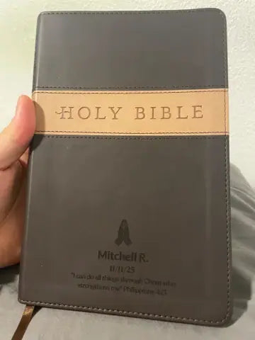 Customer holding a personalized brown Bible