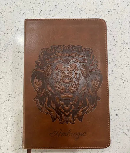 A customer’s brown Bible with a personalized lion design
