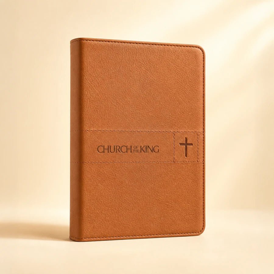 Tan Bible personalized with a church mark and cross