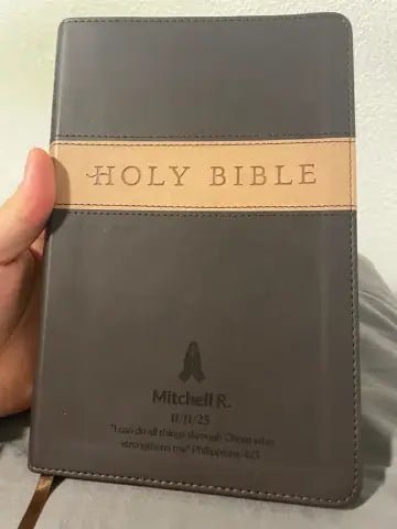 Customer holding a personalized brown Bible