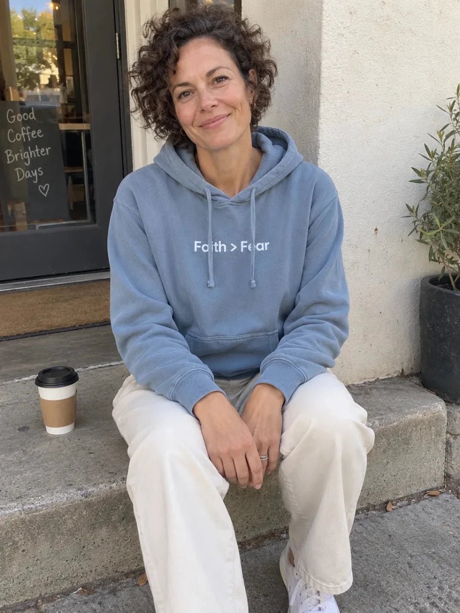 Dusty blue Faith greater than Fear hoodie on a coffee break