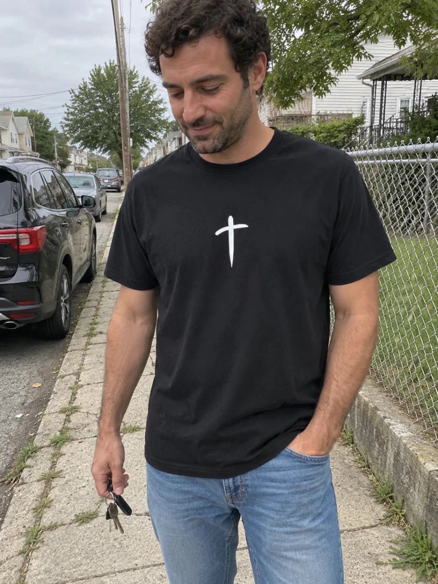 Washed black Cross tee worn on a neighborhood walk